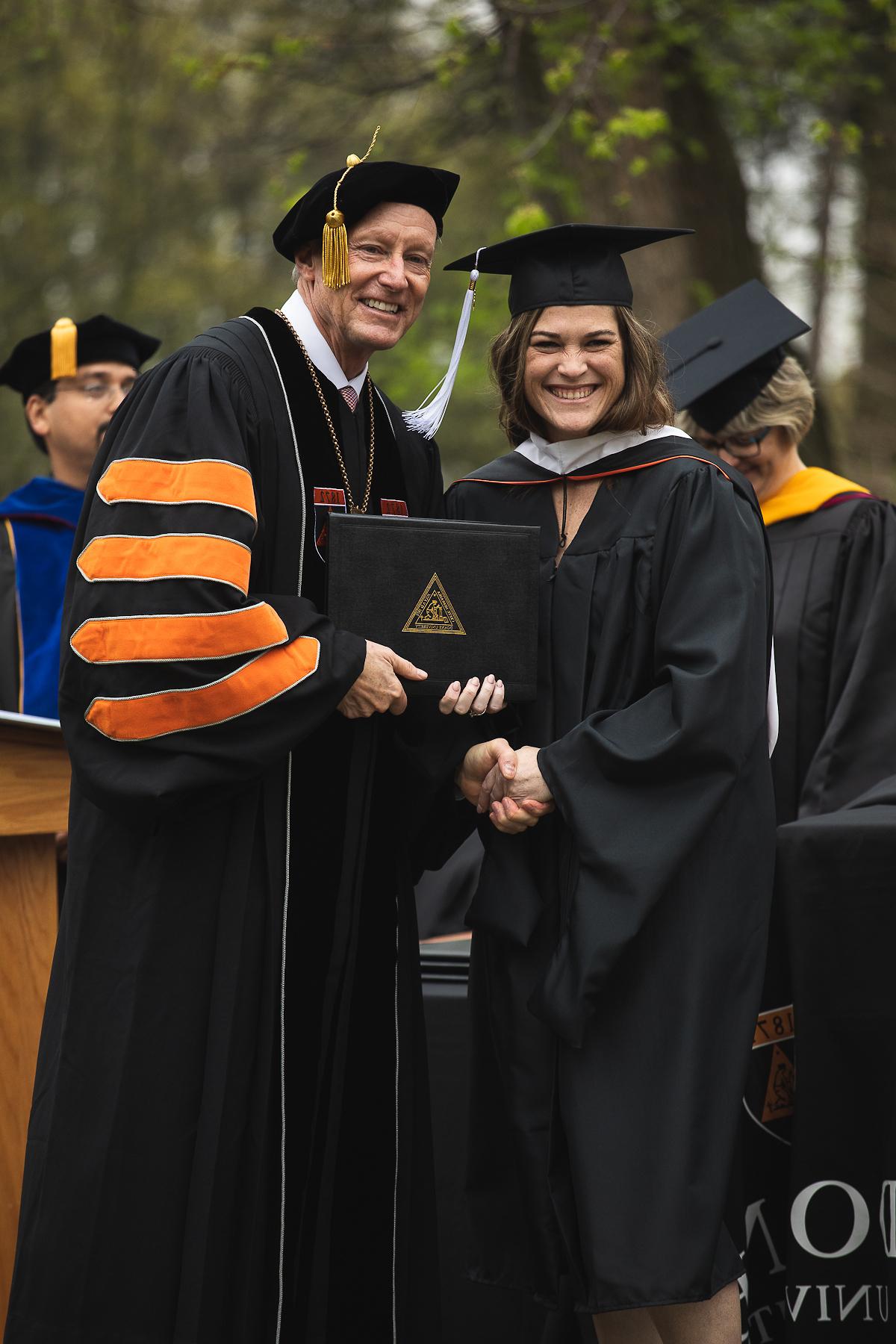 Master of Arts in Leadership Graduate with Roger Hughes at Graduation